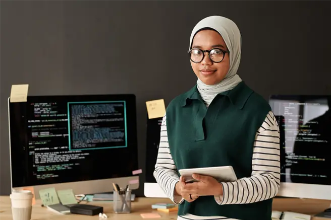 young successful muslim it engineer or software developer with tablet webp